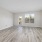 spacious living area on wood-style flooring