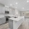 kitchen with an island, modern appliances and spacious counter-space