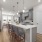 well lit kitchen with granite countertops